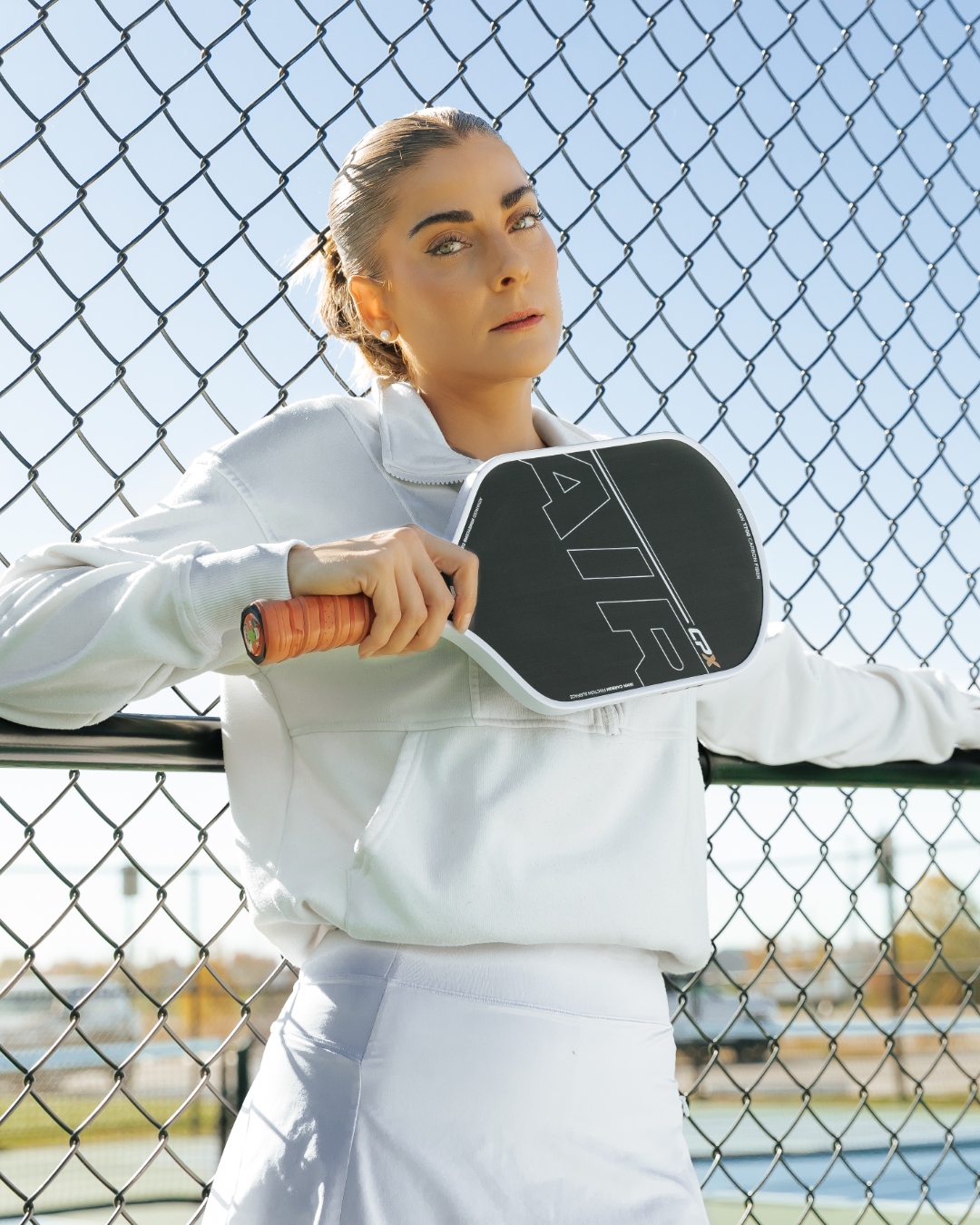 Player holding CPX Air paddle ready to play